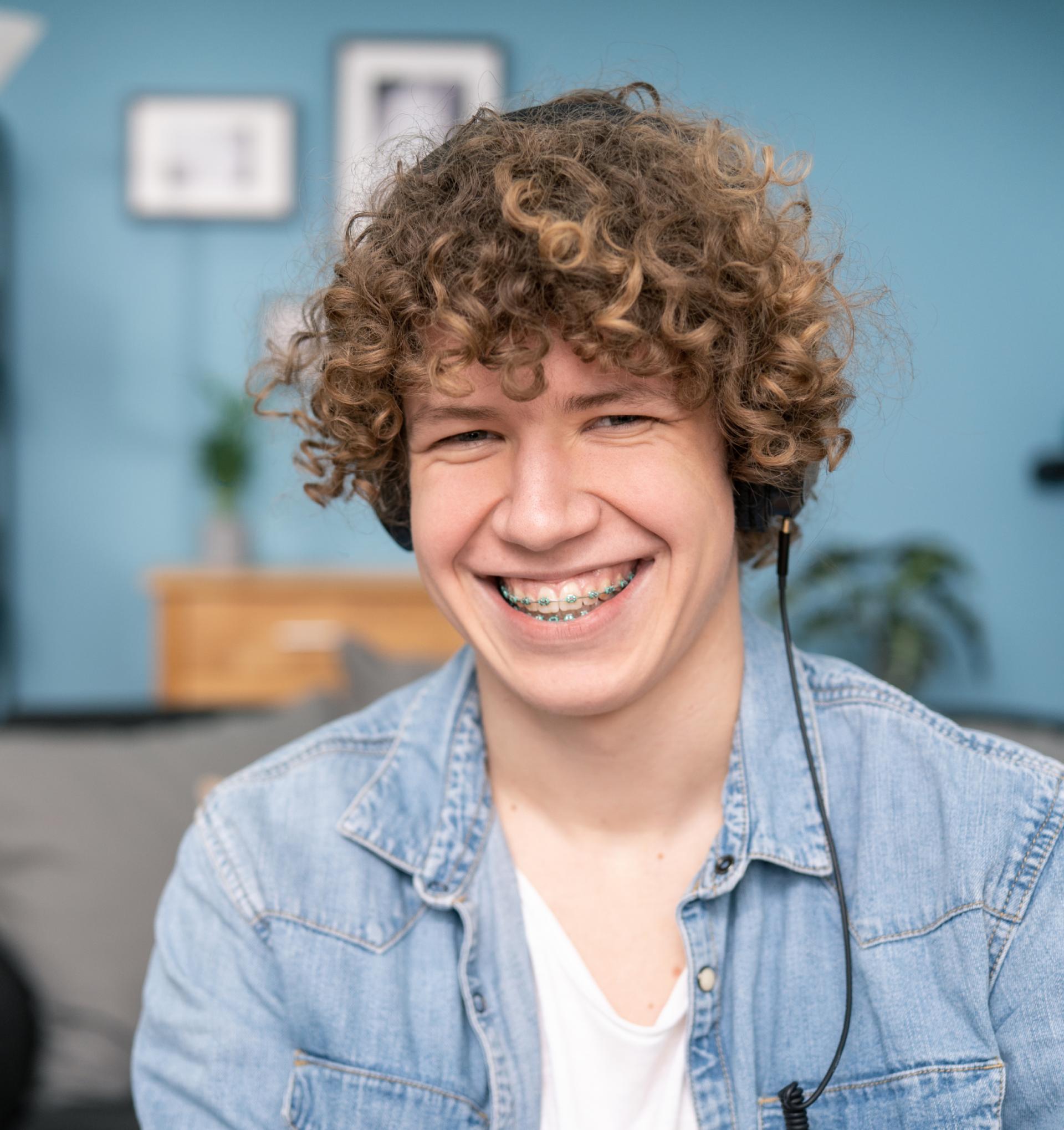 Smiling teen with braces, Hancock Orthodontics in Leesburg, VA